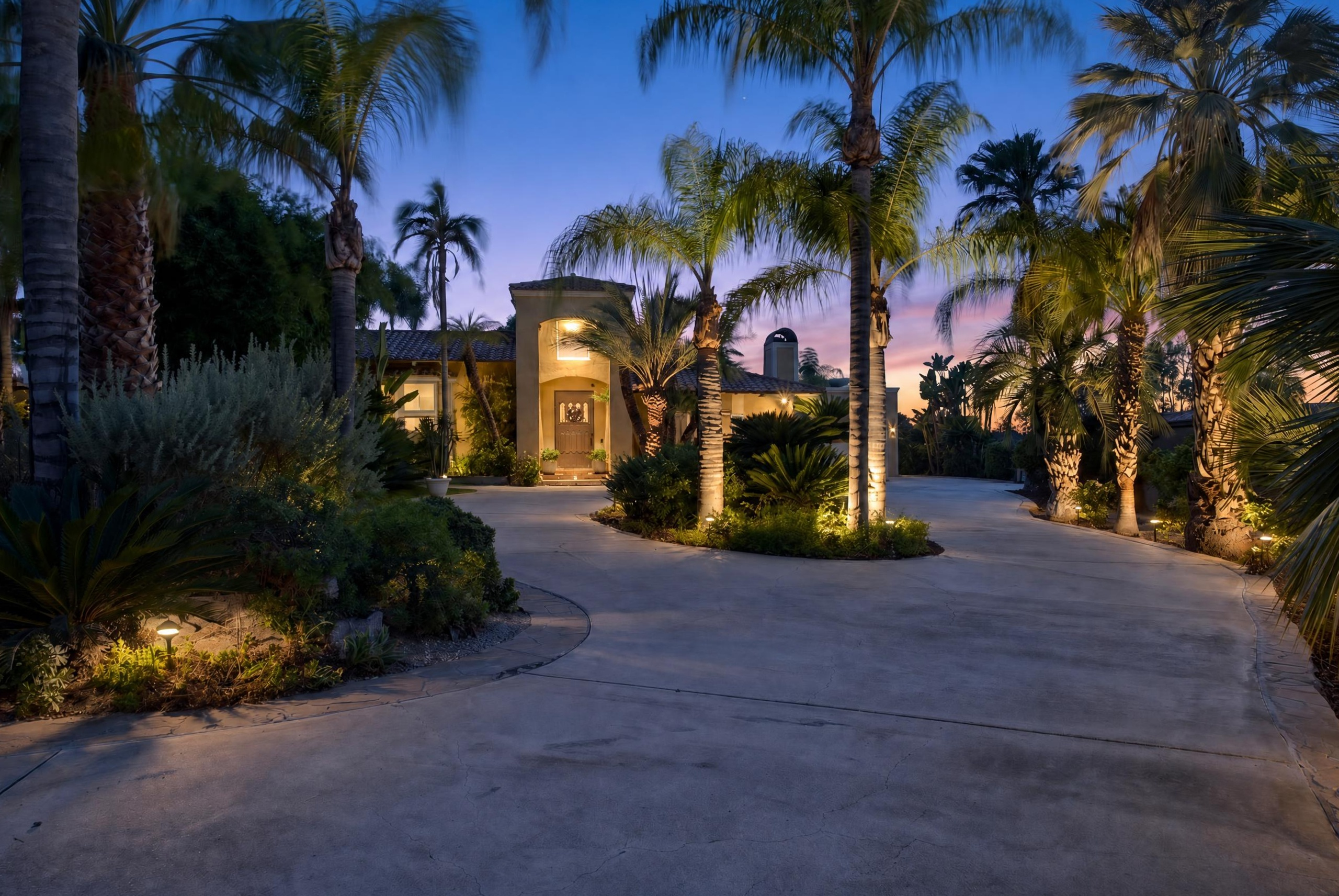 Grand luxury estate facade with manicured landscaping